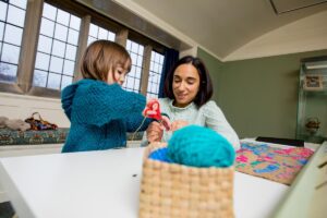 Child and mother getting involved with the creative activities in the Guild Room at Blackwell - the Arts & Crafts house.