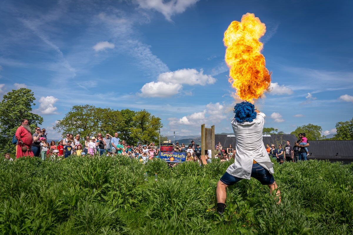 Professor Pumpernickel performing an explosive experiment on the meadow at Windermere Jetty Museum.
