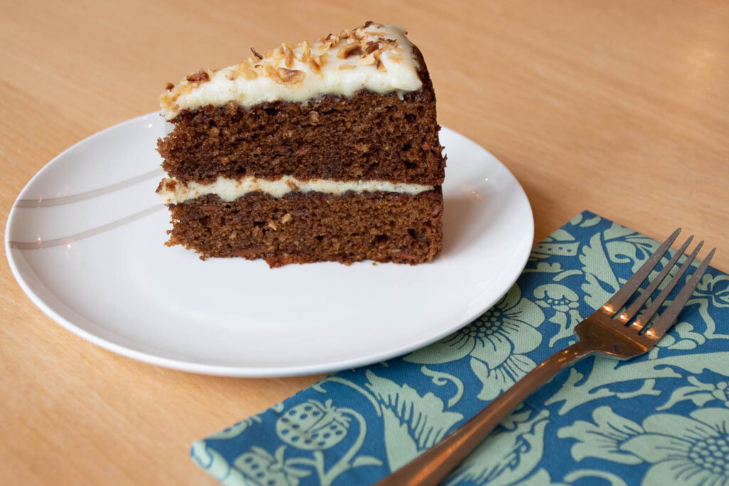 Generous slice of cake served to a customer in the Tea room.